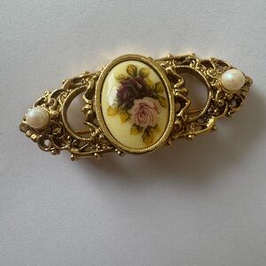 Elegant Gold and Cream Brooch with Floral Design